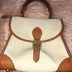 white & brown arm bag